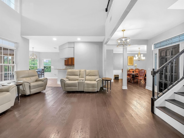 306 Marsh Point Cir, Saint Augustine, FL 32080 - living room featuring a chandelier, stairway, dark wood-type flooring, and recessed lighting