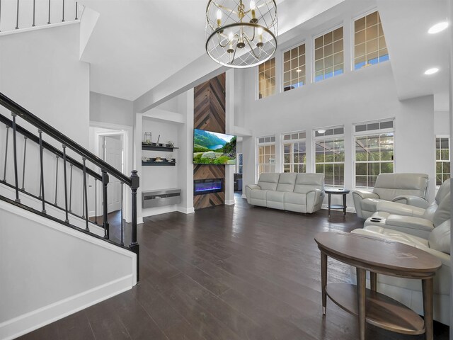 306 Marsh Point Cir, Saint Augustine, FL 32080 - living area with a high ceiling, a chandelier, wood finished floors, stairway, and recessed lighting