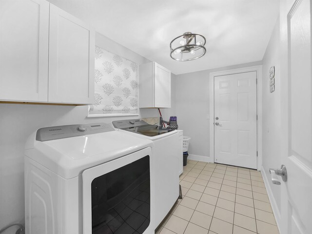 306 Marsh Point Cir, Saint Augustine, FL 32080 - laundry room with washer and clothes dryer, cabinet space, and light tile patterned floors