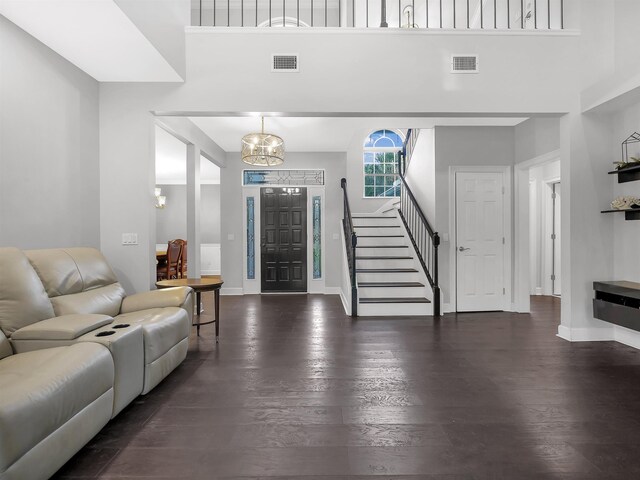 306 Marsh Point Cir, Saint Augustine, FL 32080 - foyer with stairway, a chandelier, wood finished floors, and a towering ceiling