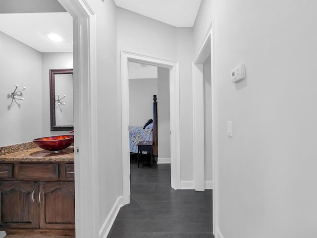 306 Marsh Point Cir, Saint Augustine, FL 32080 - hall with a sink and dark wood-style flooring