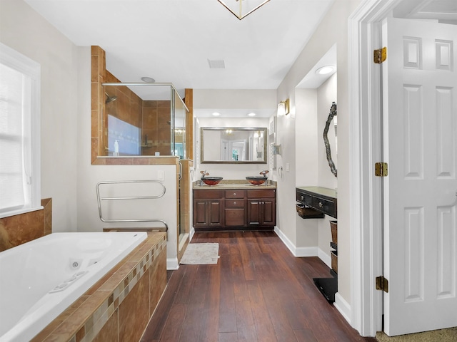 306 Marsh Point Cir, Saint Augustine, FL 32080 - full bath featuring a shower stall, a tub with jets, vanity, and wood-type flooring