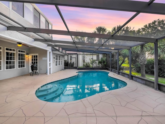 306 Marsh Point Cir, Saint Augustine, FL 32080 - pool at dusk featuring a patio, an outdoor pool, and glass enclosure