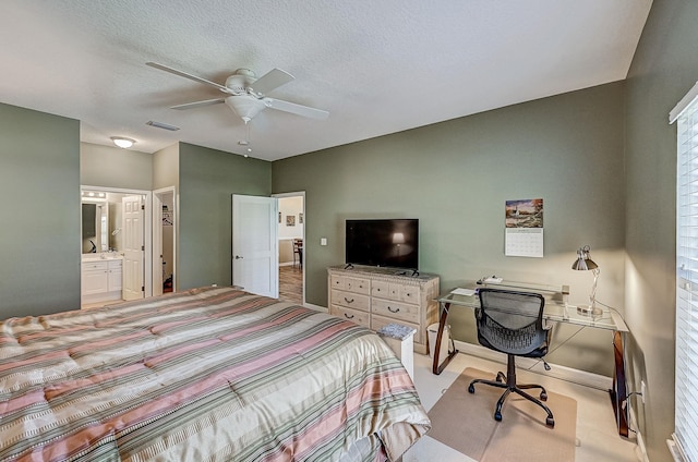 112 Laurel Wood Way Unit 202, Saint Augustine, FL 32086 - bedroom with a desk, ceiling fan, and ensuite bath