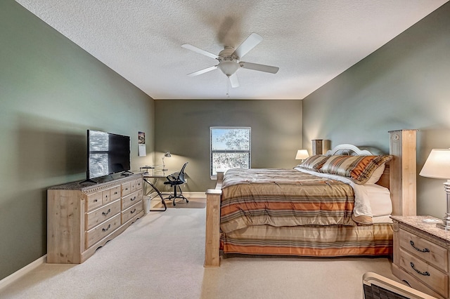 112 Laurel Wood Way Unit 202, Saint Augustine, FL 32086 - bedroom featuring light colored carpet, a textured ceiling, ceiling fan, and baseboards
