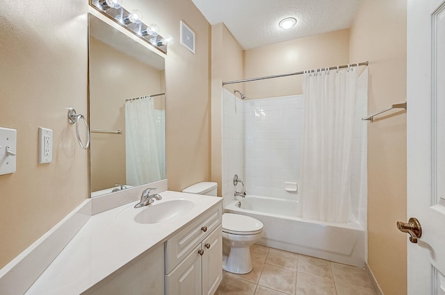 112 Laurel Wood Way Unit 202, Saint Augustine, FL 32086 - bathroom featuring toilet, tile patterned floors, shower / bath combo, vanity, and a textured ceiling