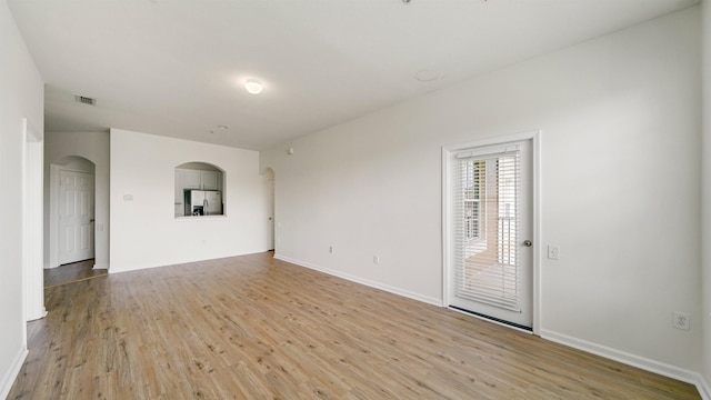 7990 Baymeadows Rd Unit 1114, Jacksonville, FL 32256 - unfurnished room featuring light wood finished floors and arched walkways
