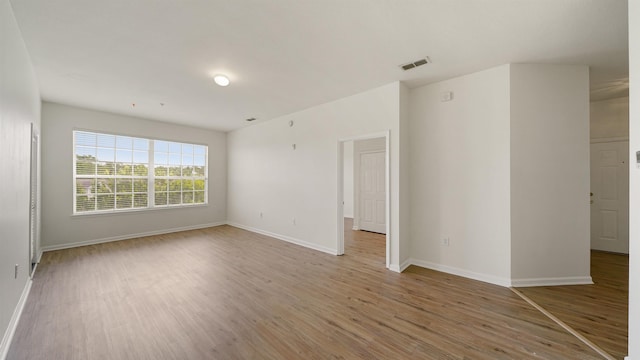 7990 Baymeadows Rd Unit 1114, Jacksonville, FL 32256 - unfurnished room with light wood-style flooring and baseboards
