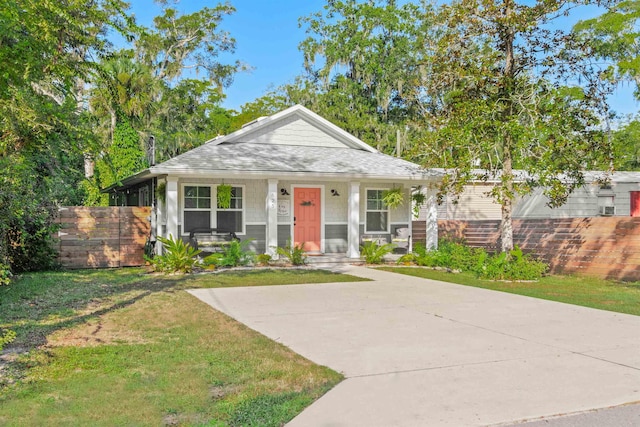 view of front of house featuring a front lawn and a porch