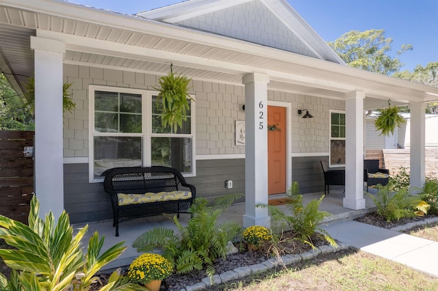 entrance to property featuring a porch