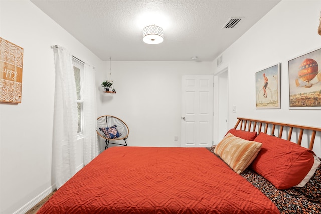 bedroom with a textured ceiling