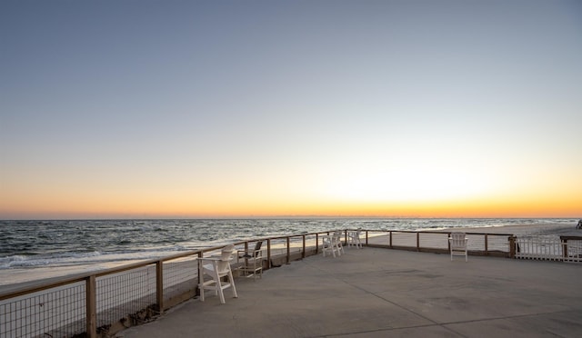 exterior space featuring a view of the beach and a water view