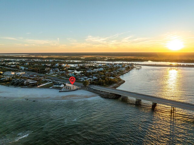 aerial view at dusk with a water view