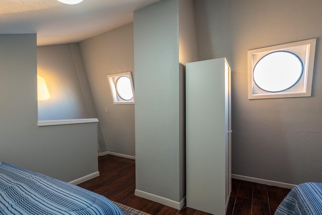 bedroom with dark wood-type flooring