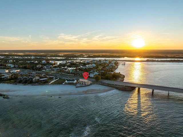 aerial view at dusk with a water view