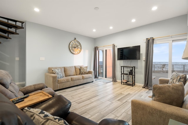 living room with light hardwood / wood-style flooring