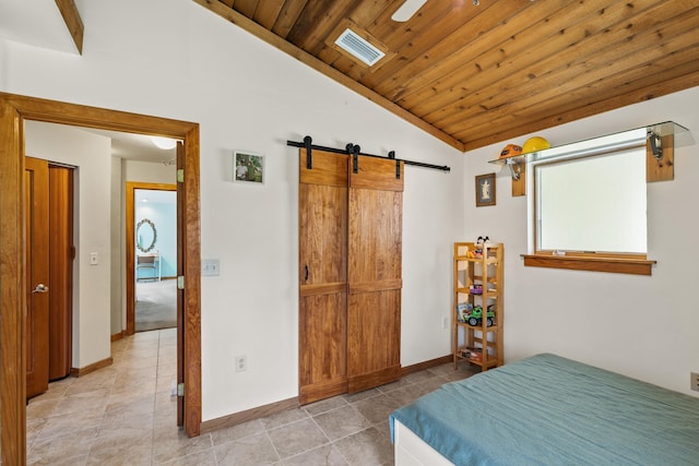 bedroom with light tile patterned floors, lofted ceiling, visible vents, a barn door, and wood ceiling