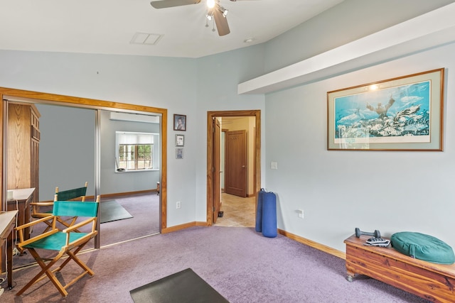 living area with lofted ceiling, ceiling fan, carpet floors, visible vents, and baseboards