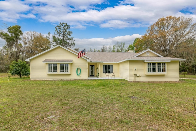 single story home featuring a patio area and a front lawn