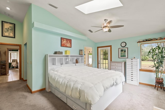 bedroom with lofted ceiling with skylight, access to outside, light colored carpet, and visible vents