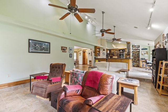 living room with high vaulted ceiling and rail lighting