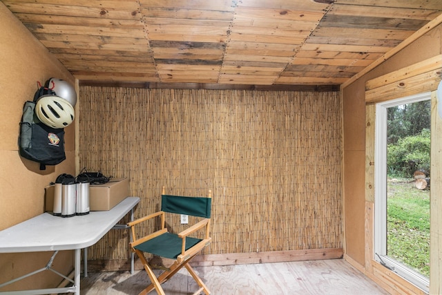 interior space featuring wood ceiling, wood finished floors, and a wealth of natural light