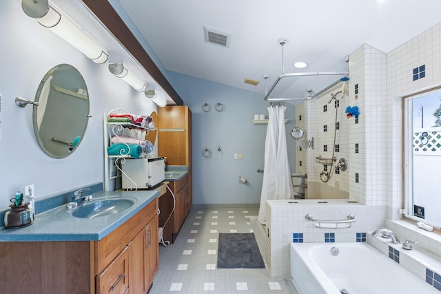 bathroom with a tub to relax in, vanity, visible vents, baseboards, and a shower stall