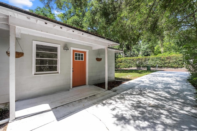 1617 Cleveland Ave, Palatka, FL 32177 - view of exterior entry with a patio area and concrete block siding