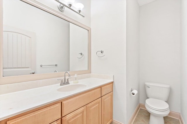 3330 Lewis Speedway, Saint Augustine, FL 32084 - bathroom featuring tile patterned flooring, baseboards, toilet, and vanity