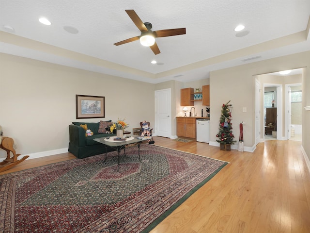 100 Coppinger Pl, Saint Johns, FL 32259 - living area featuring a ceiling fan, light wood-style floors, a raised ceiling, and recessed lighting