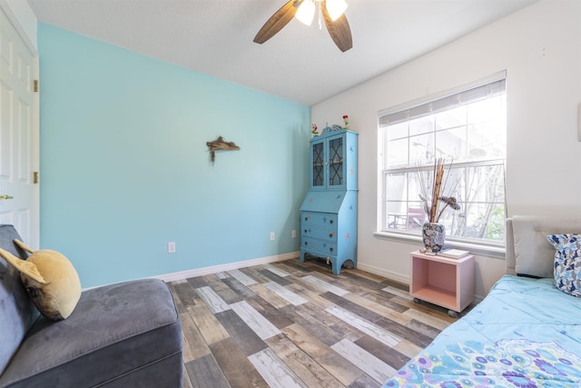 bedroom with ceiling fan and hardwood / wood-style floors