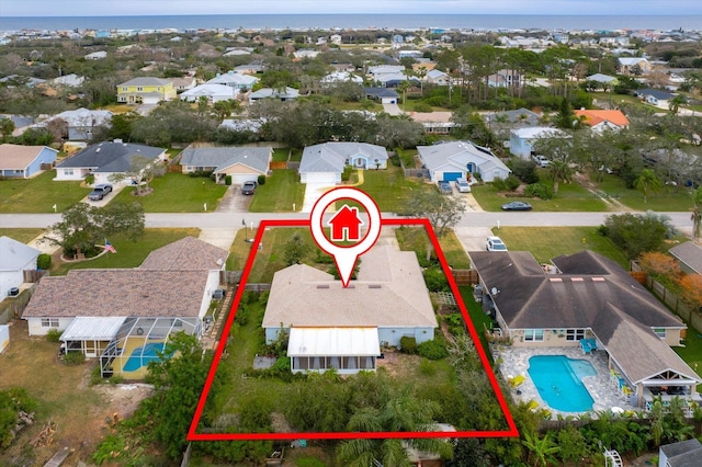 birds eye view of property with a water view