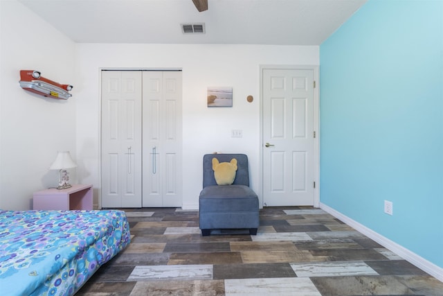 bedroom with a closet and dark hardwood / wood-style flooring