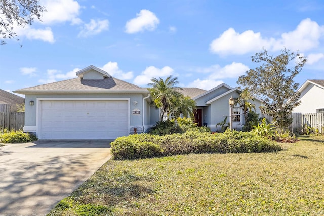 view of front of house featuring a garage and a front yard