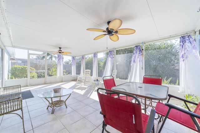 sunroom / solarium featuring ceiling fan and plenty of natural light