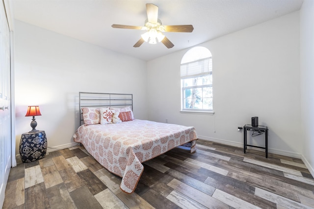 bedroom featuring ceiling fan and dark hardwood / wood-style floors