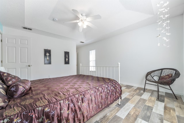 bedroom with light hardwood / wood-style floors and ceiling fan