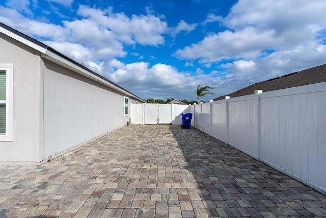 view of patio / terrace featuring a fenced backyard and a gate