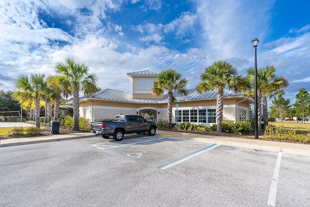 view of property with uncovered parking
