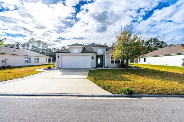 traditional-style house with an attached garage, driveway, and a front lawn