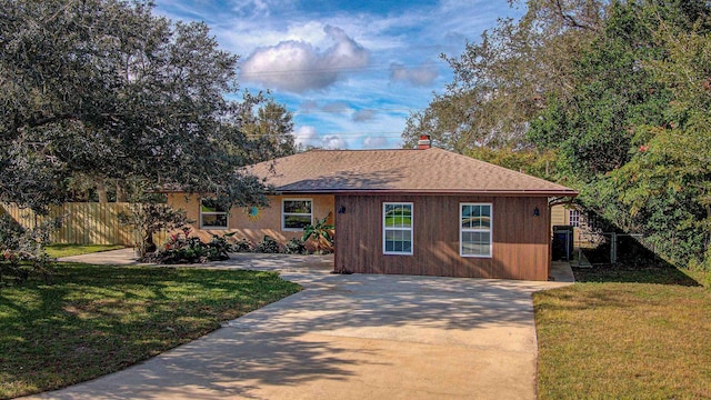 ranch-style house with a front yard