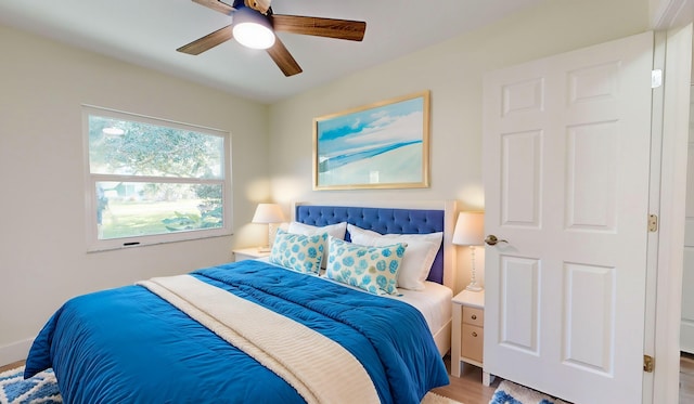 bedroom featuring ceiling fan and wood-type flooring