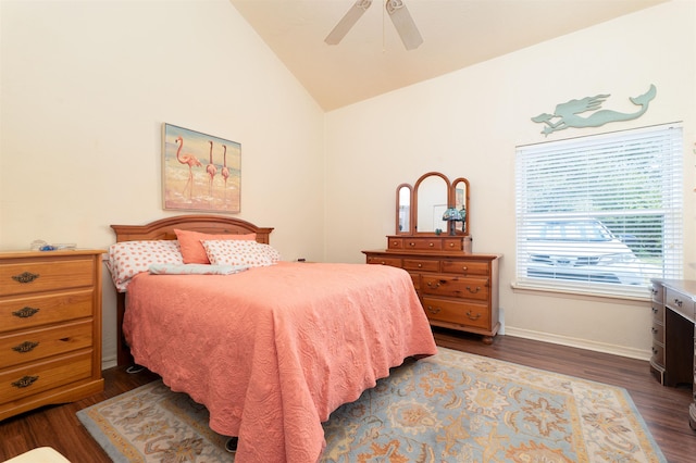 bedroom with dark hardwood / wood-style flooring, vaulted ceiling, and ceiling fan