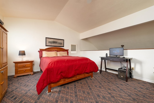 bedroom featuring vaulted ceiling and dark colored carpet