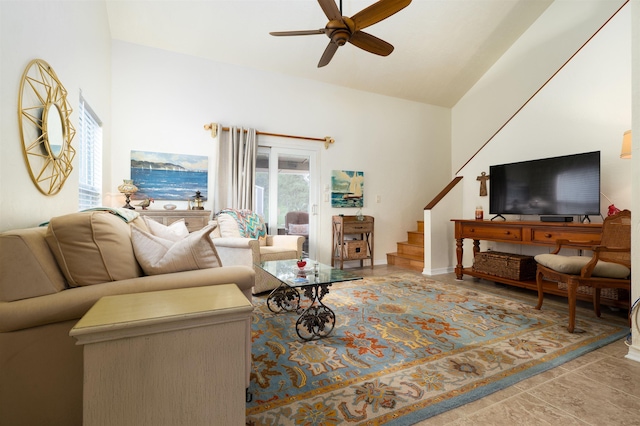 living room featuring tile patterned flooring, vaulted ceiling, and ceiling fan