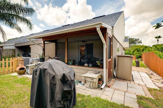 rear view of house with a patio and central air condition unit