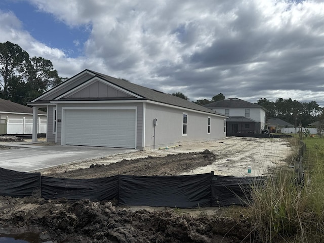 view of side of property with a garage