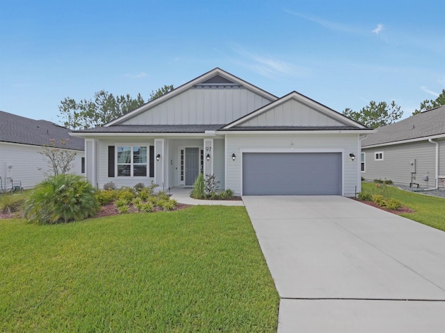 view of front facade with a garage and a front lawn