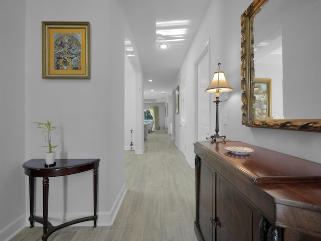 corridor with light wood-type flooring