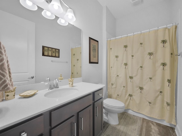 full bathroom with vanity, toilet, and shower / bath combo with shower curtain